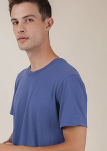 man wearing basic tee in sapphire side view