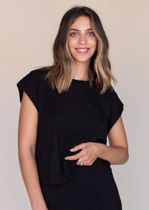 woman wearing cropped tank top in black