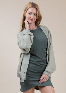 woman wearing oversized cardigan in sage