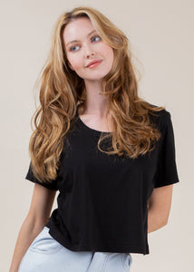 woman wearing cropped tee with open neck in black