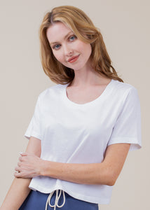 woman wearing cropped tee with open neck in white