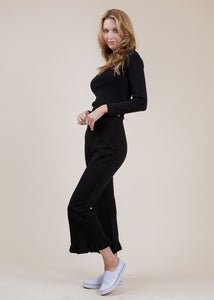 woman wearing cropped frill sweatpants in black
