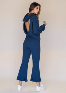 woman wearing cropped frill sweatpants in navy