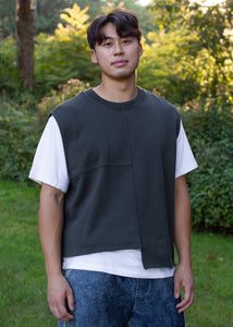 man wearing charcoal colored vest