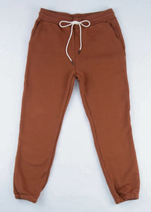 flat lay of women's rust sweatpants