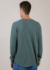 back of man wearing henley long sleeve in pine green