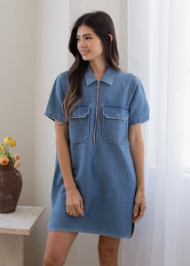 woman wearing indigo half zip dress in medium wash