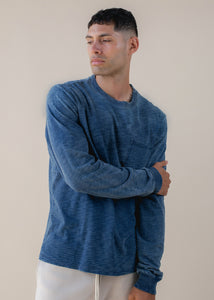 man wearing indigo long sleeve in medium wash