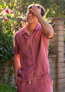 man wearing pink linen button down