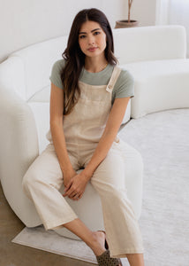 woman wearing linen overall in natural