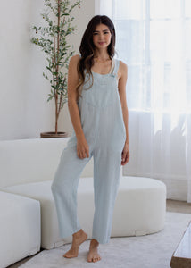 woman wearing linen overall in powder blue