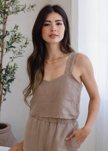 woman wearing cropped linen strap tank in taupe brown