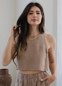 woman wearing cropped linen tank in taupe brown