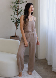 woman wearing wide leg linen pants in taupe brown
