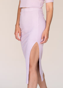 woman wearing glee and co 5x3 rib midi slit skirt in color apricot
