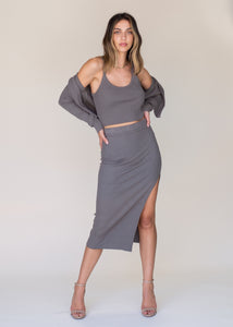 woman wearing glee and co 5x3 rib midi slit skirt in color cement